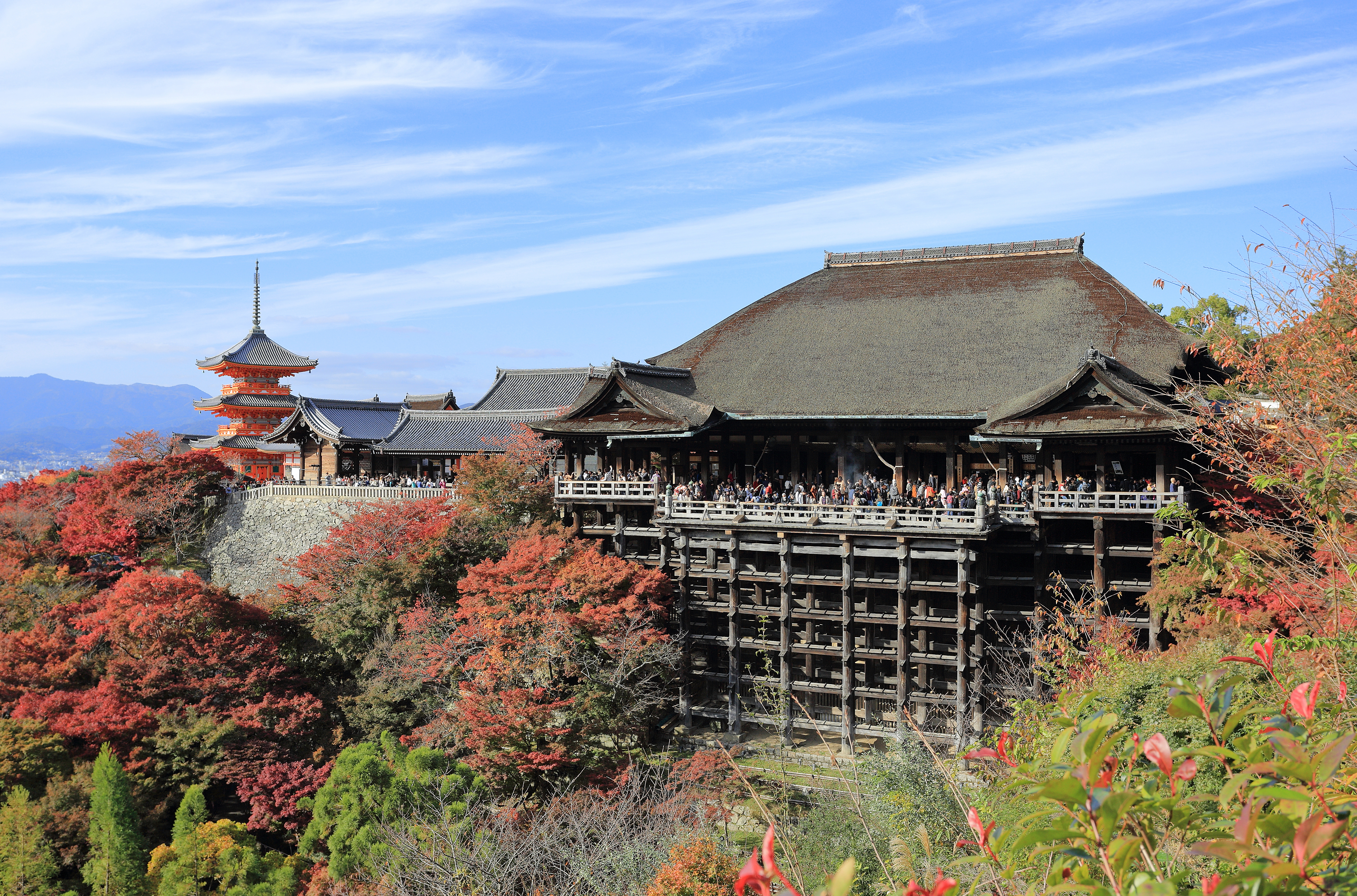 Kiyomizu-dera main hall and three-storied pagoda amid autumn leaves
