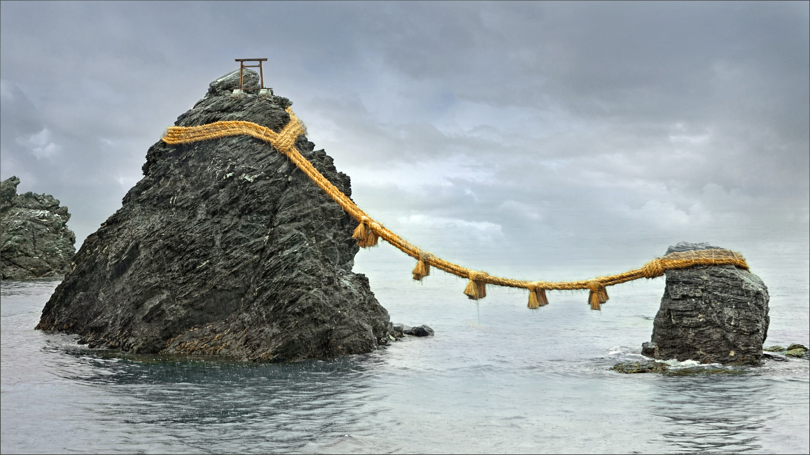Meoto Iwa, the Wedded Rocks at Futami, joined by a sacred shimenawa straw rope