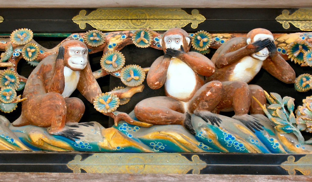 The three wise monkeys carved on the sacred stable at Nikkō Tōshō-gū