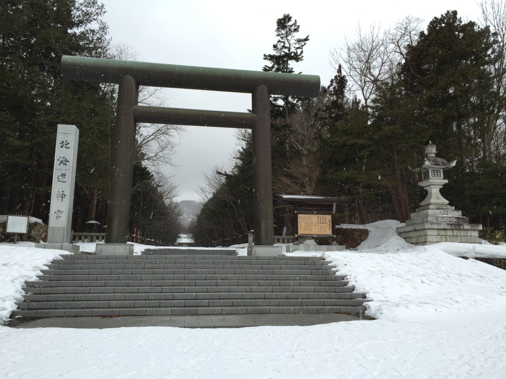 The second torii gate of Hokkaido Jingu on the snow-covered approach in winter